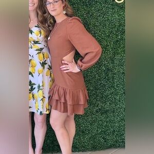 Elegant Ruffle Dress. Open back, lace down closure. Shoulder puff sleeve.